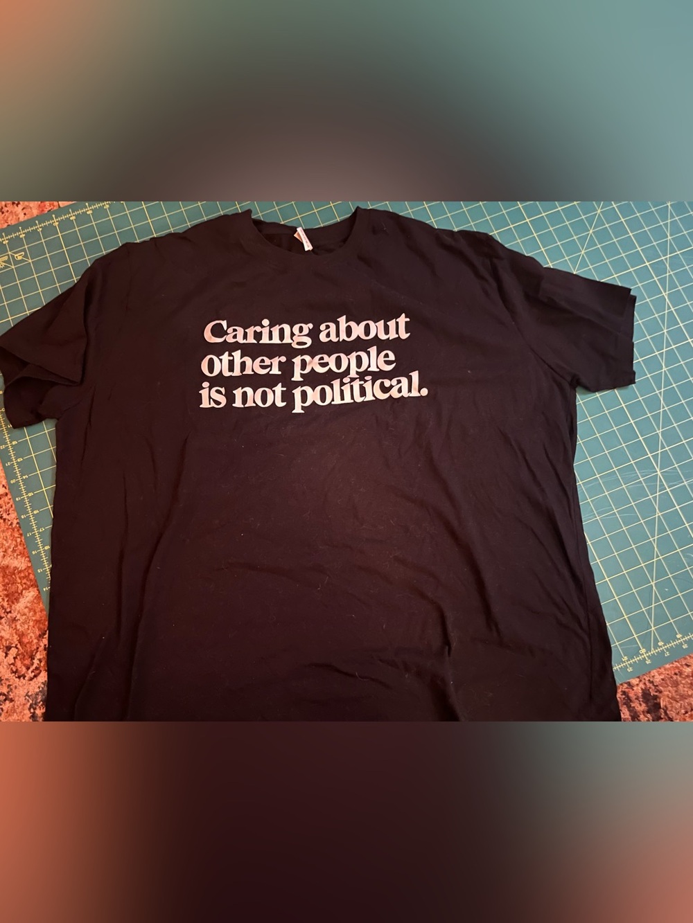 Black Short-Sleeve Graphic Tee - "Caring about other people is not political."